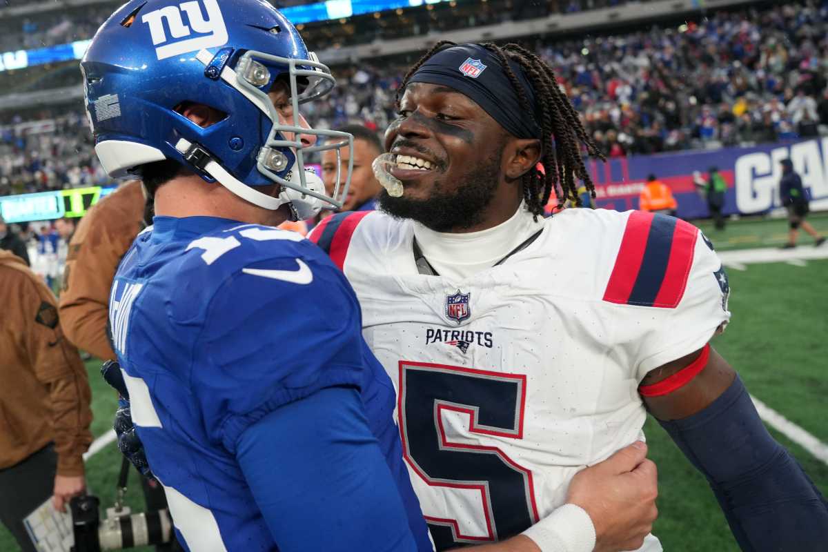New England Patriots safety Jabrill Peppers congratulates New York Giants quarterback Tommy DeVito after the quarterback won the first game he started in the NFL, 10-7, Sunday, November 26, 2023.
