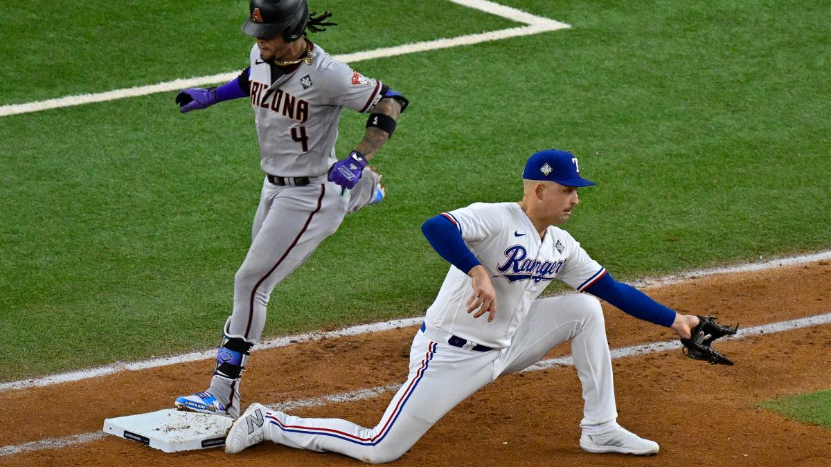 Texas Rangers first baseman Nathaniel Lowe puts out Arizona Diamondbacks second baseman Ketel Marte