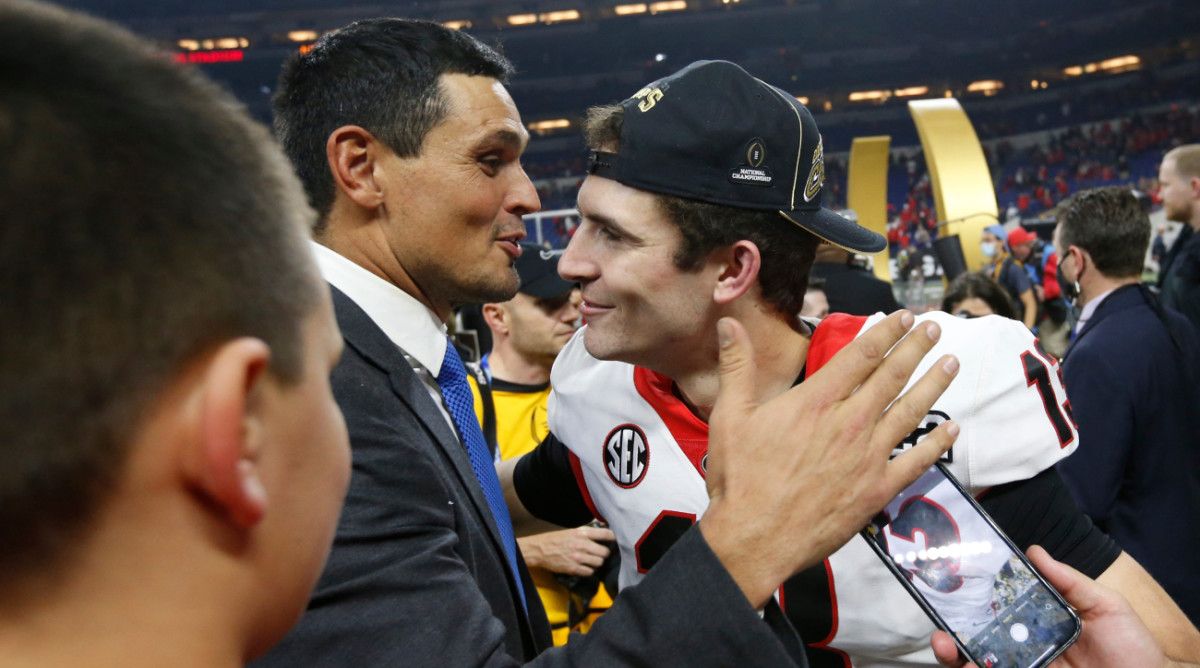 David Pollack embraces Georgia quarterback Stetson Bennett after the national championship game.