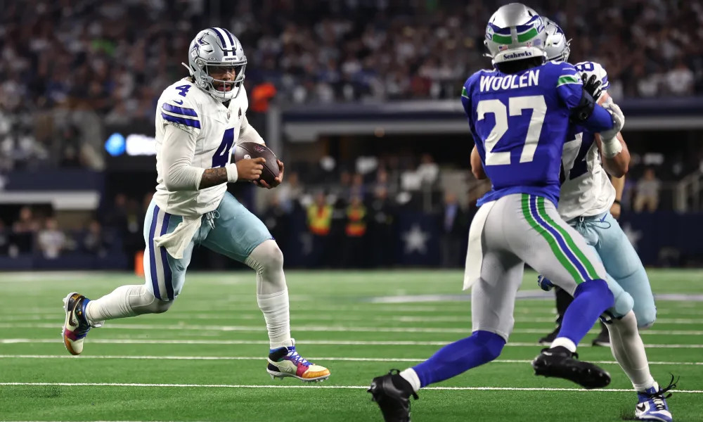 Prescott attempts to move the chains with his legs against Seattle.