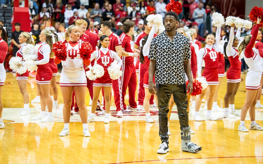 Indiana University's Xavier Johnson stands in street clothes as the Hoosiers warm-up before the start of the Indiana versus Maryland men's basketball game.