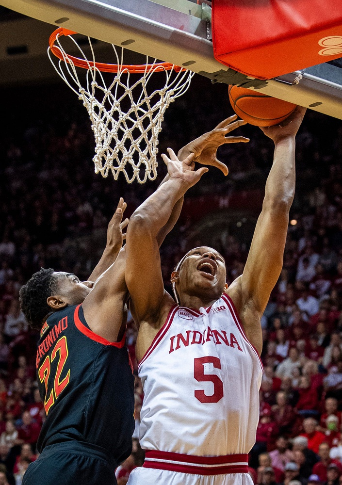 Indiana University's Malik Reneau (5) scores past Maryland's Jordan Geronimo (22) during the first half of the Indiana versus Maryland men's basketball game at Simon Skjodt Assembly Hall .  