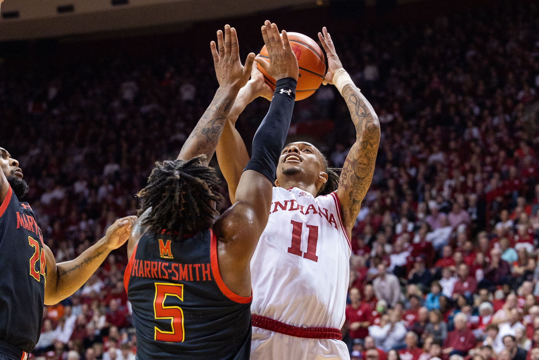 Indiana Hoosiers guard CJ Gunn (11) shoots the ball while Maryland Terrapins guard DeShawn Harris-Smith (5) defends at Simon Skjodt Assembly Hall.