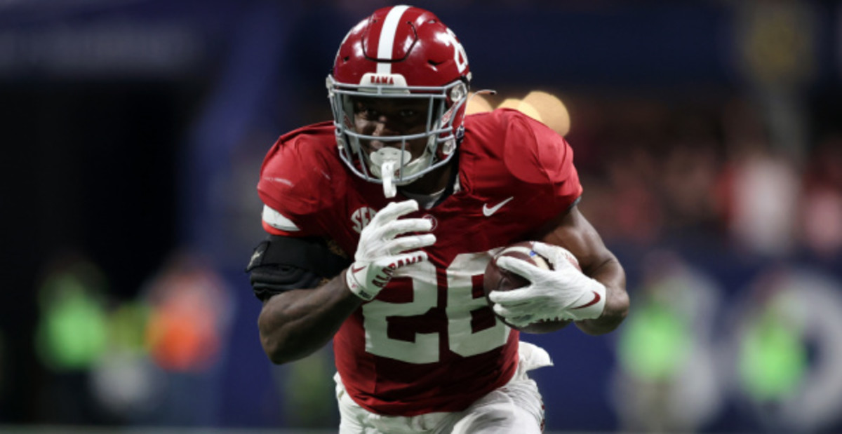 Alabama Crimson Tide running back Jam Miller on a rushing attempt in a college football game in the SEC.