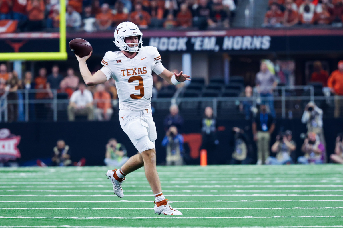 Texas Longhorns quarterback Quinn Ewers (3) looks to pass during the first half against the Oklahoma State Cowboys at AT&T Stadium.