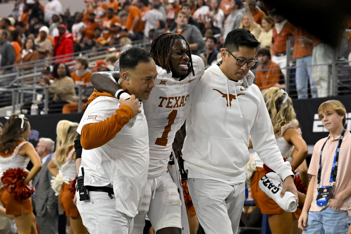 Texas Longhorns Xavier Worthy being helped to the locker room at AT&T Stadium 
