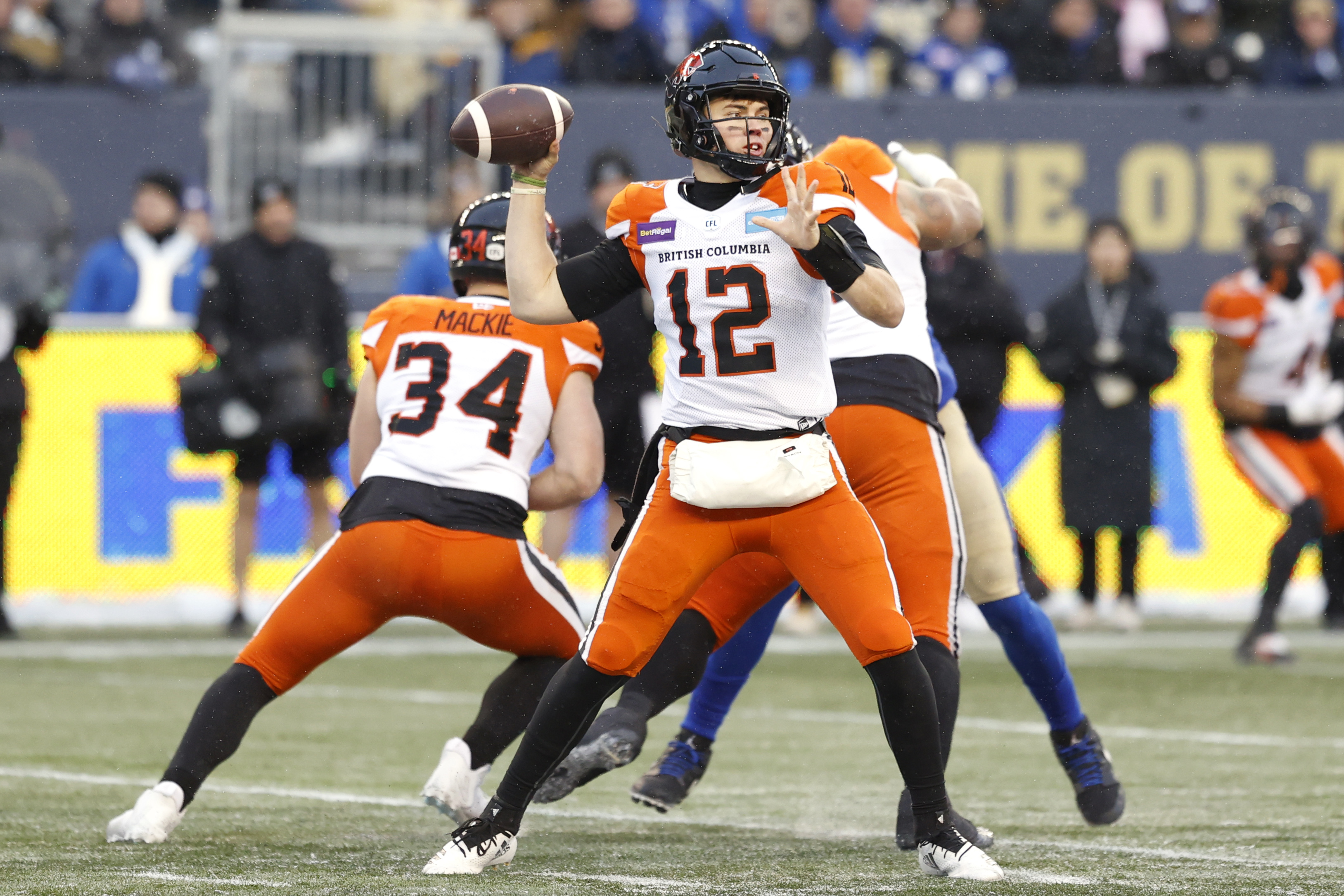 Nov 13, 2022; Winnigeg, Manitoba, CAN; BC Lions quarterback Nathan Rourke (12) gets set to make a pass against the Winnipeg Blue Bombers at Investors Group Field. Mandatory Credit: James Carey Lauder-USA TODAY Sports