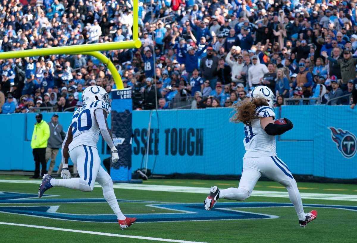 Indianapolis Colts linebacker Grant Stuard (41) runs in a touchdown against the Tennessee Titans in the fourth quarter after recovering a blocked Titans punt during their game at Nissan Stadium in Nashville, Tenn., Sunday, Dec. 3, 2023.