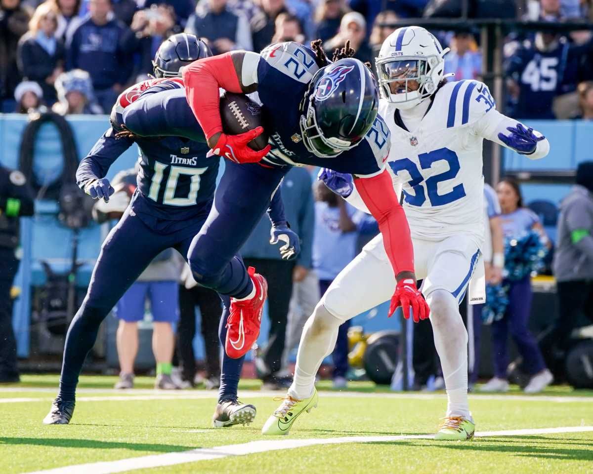 Tennessee Titans running back Derrick Henry (22) leaps for a touchdown against the Indianapolis Colts during the second quarter at Nissan Stadium in Nashville, Tenn., Sunday, Dec. 3, 2023.