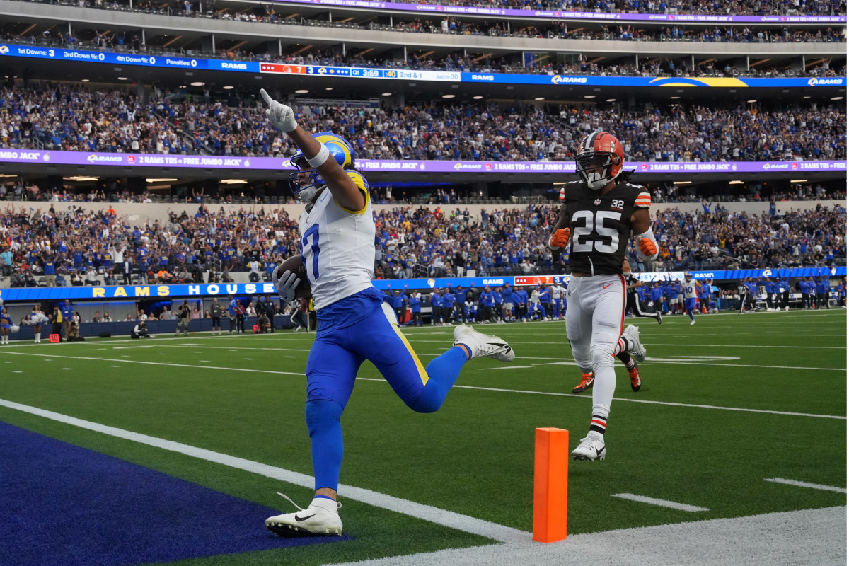 Los Angeles Rams wide receiver Puka Nacua (17) scores on a 70-yard touchdown reception against Cleveland Browns cornerback Kahlef Hailassie (25) in the first half at SoFi Stadium.