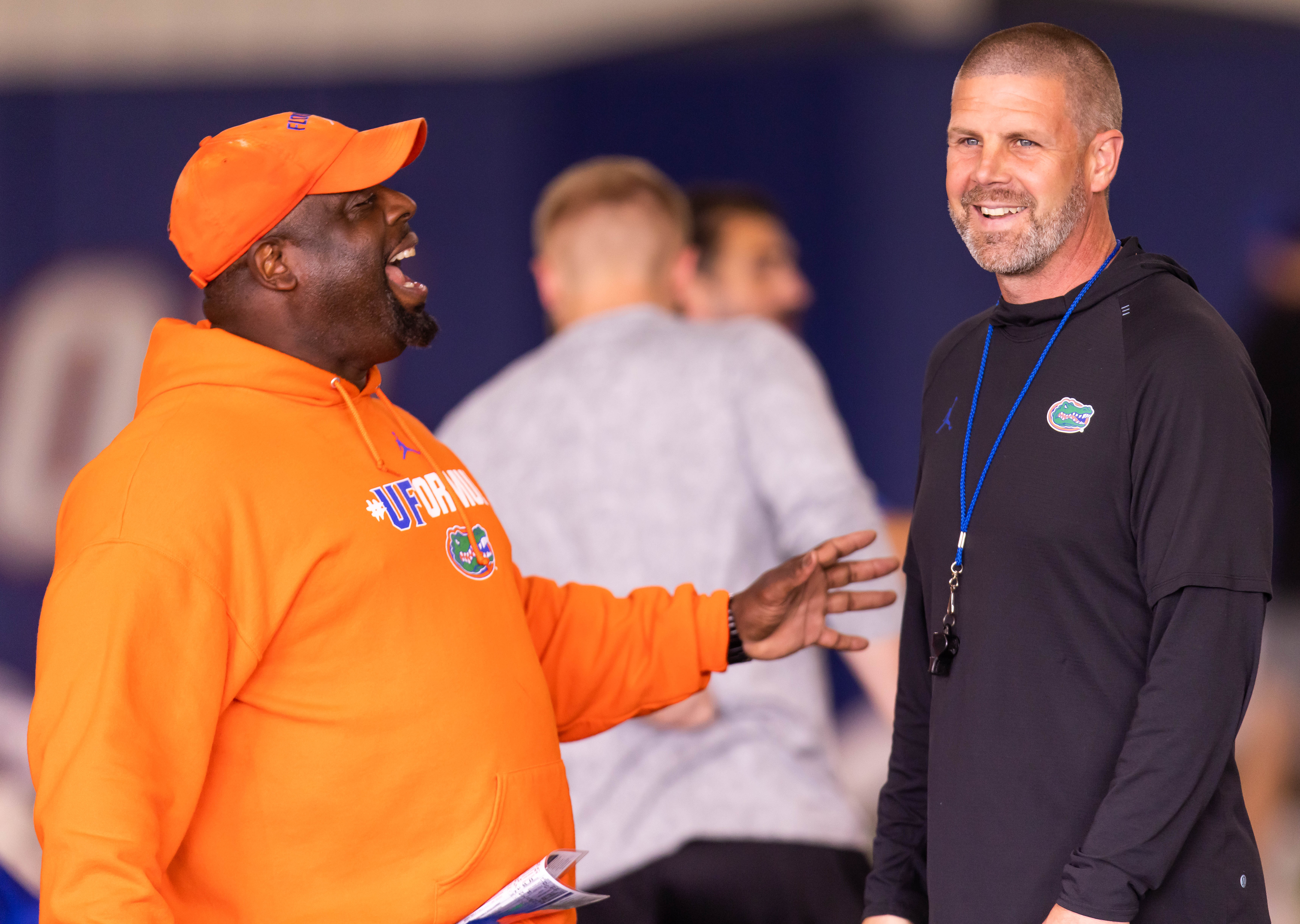 Florida Co-Defensive Coordinator Sean Spencer, left, talks with Florida Gators head coach Billy Napier during warmups. The University of Florida Gators held their 14th Spring football practice at Sanders Practice Fields in Gainesville, FL on Tuesday, April 11, 2023.