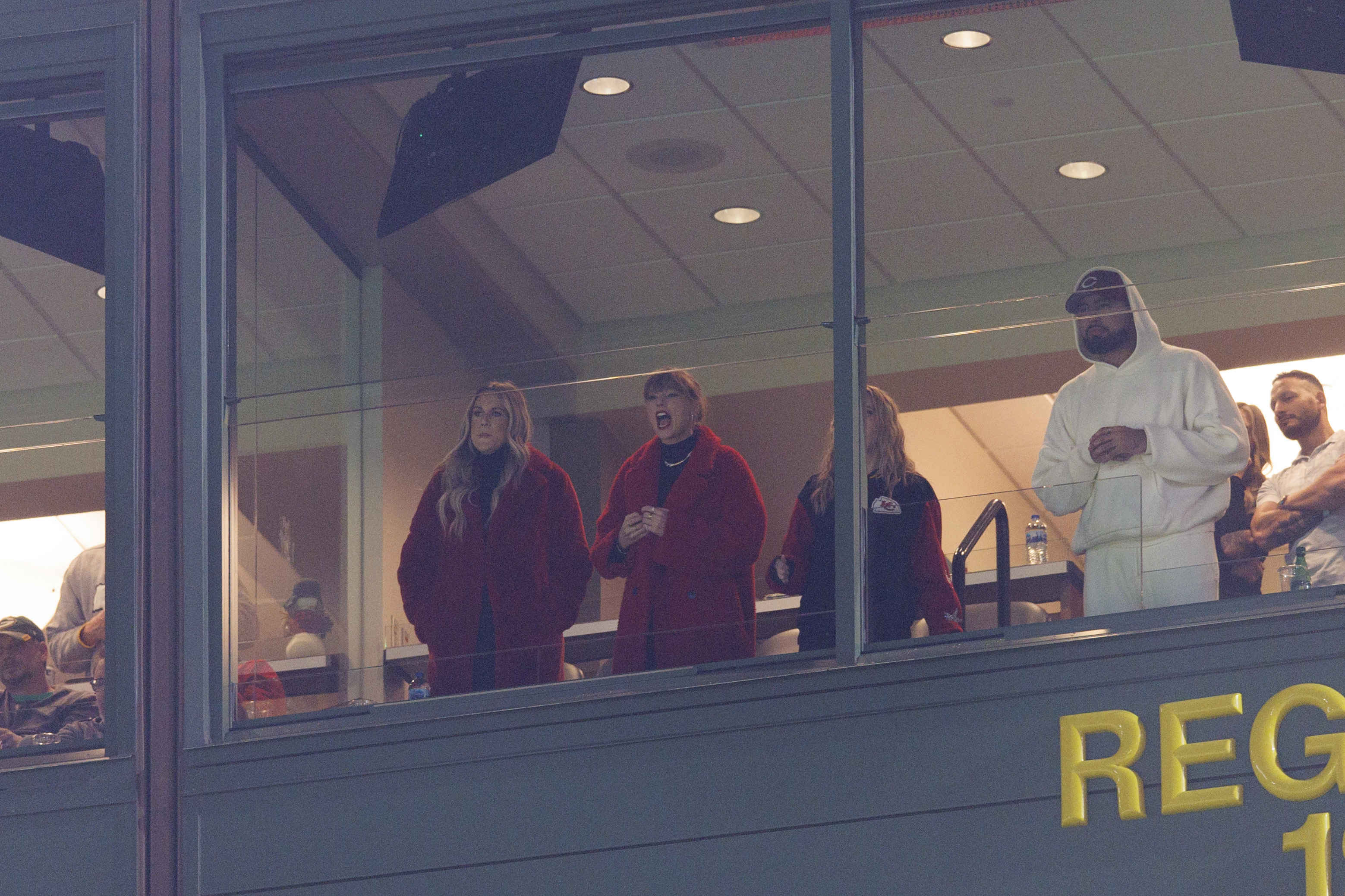  Dec 3, 2023; Green Bay, Wisconsin, USA; Taylor Swift, center, cheers during the third quarter of the game between the Kansas City Chiefs and Green Bay Packers at Lambeau Field.