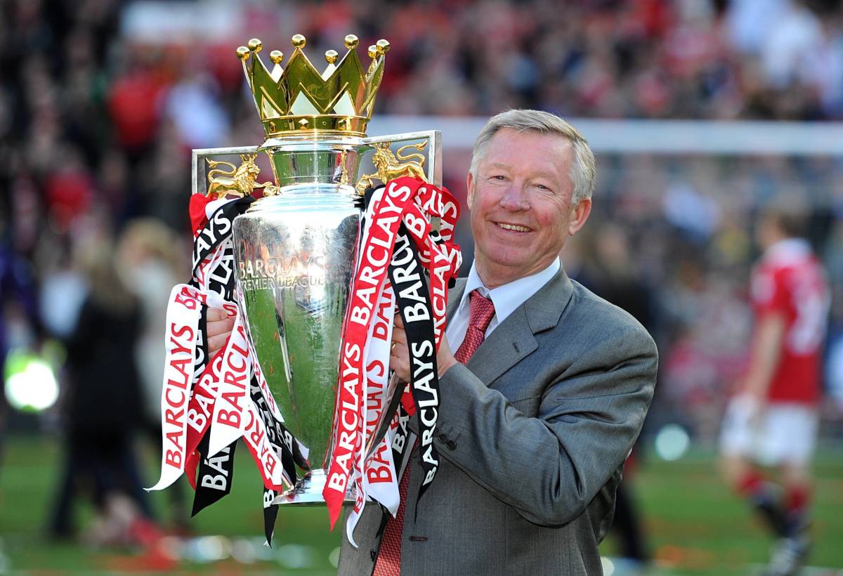 Sir Alex Ferguson pictured holding the Premier League trophy after leading Manchester United to title glory in the 2010/11 season