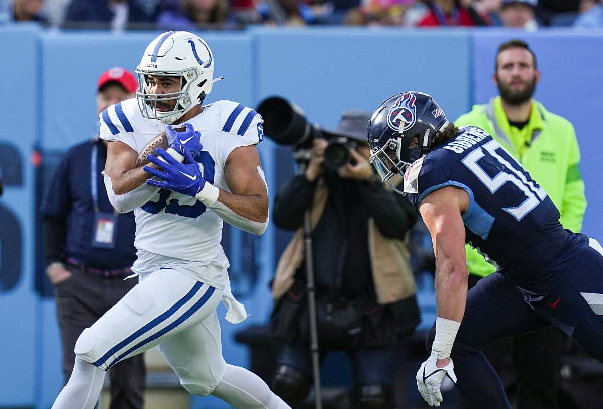 Tennessee Titans linebacker Jack Gibbens (50) chases after Indianapolis Colts tight end Kylen Granson (83) as he makes a reception Sunday, Dec. 3, 2023, at Nissan Stadium in Nashville, Tenn.