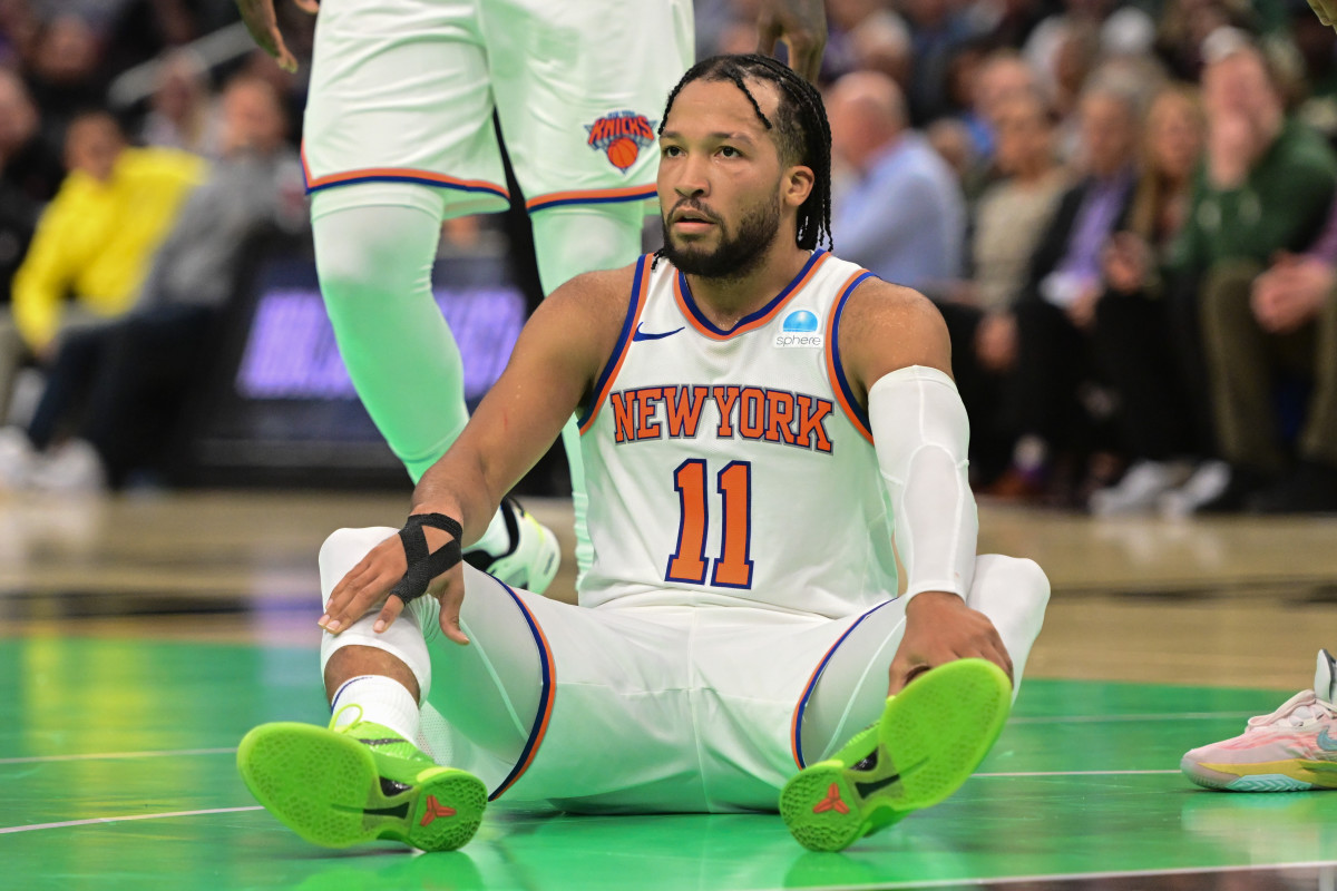 Nov 3, 2023; Milwaukee, Wisconsin, USA; New York Knicks guard Jalen Brunson (11) sits after being fouled in the fourth quarter against the Milwaukee Bucks at Fiserv Forum.
