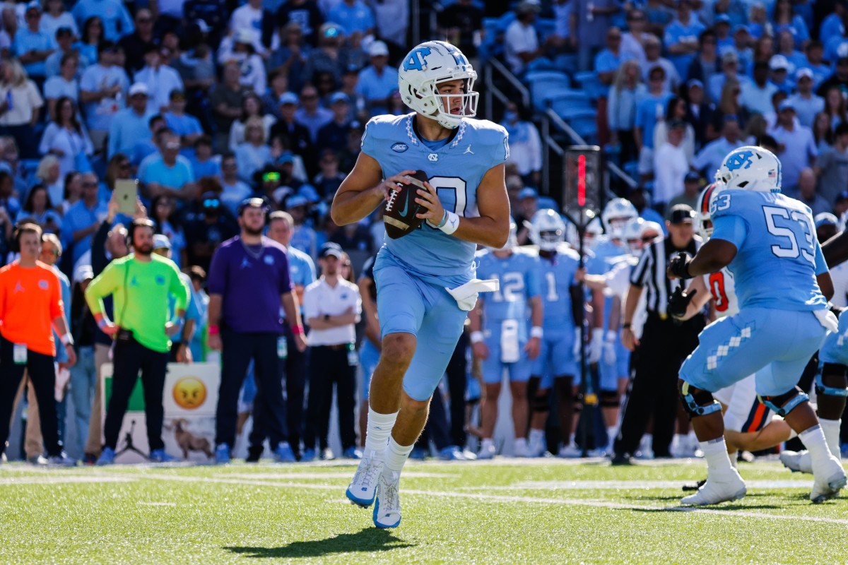 Oct 7, 2023; Chapel Hill, North Carolina, USA; North Carolina Tar Heels quarterback Drake Maye (10) runs the ball during the first half of the game against the Syracuse Orange at Kenan Memorial Stadium.