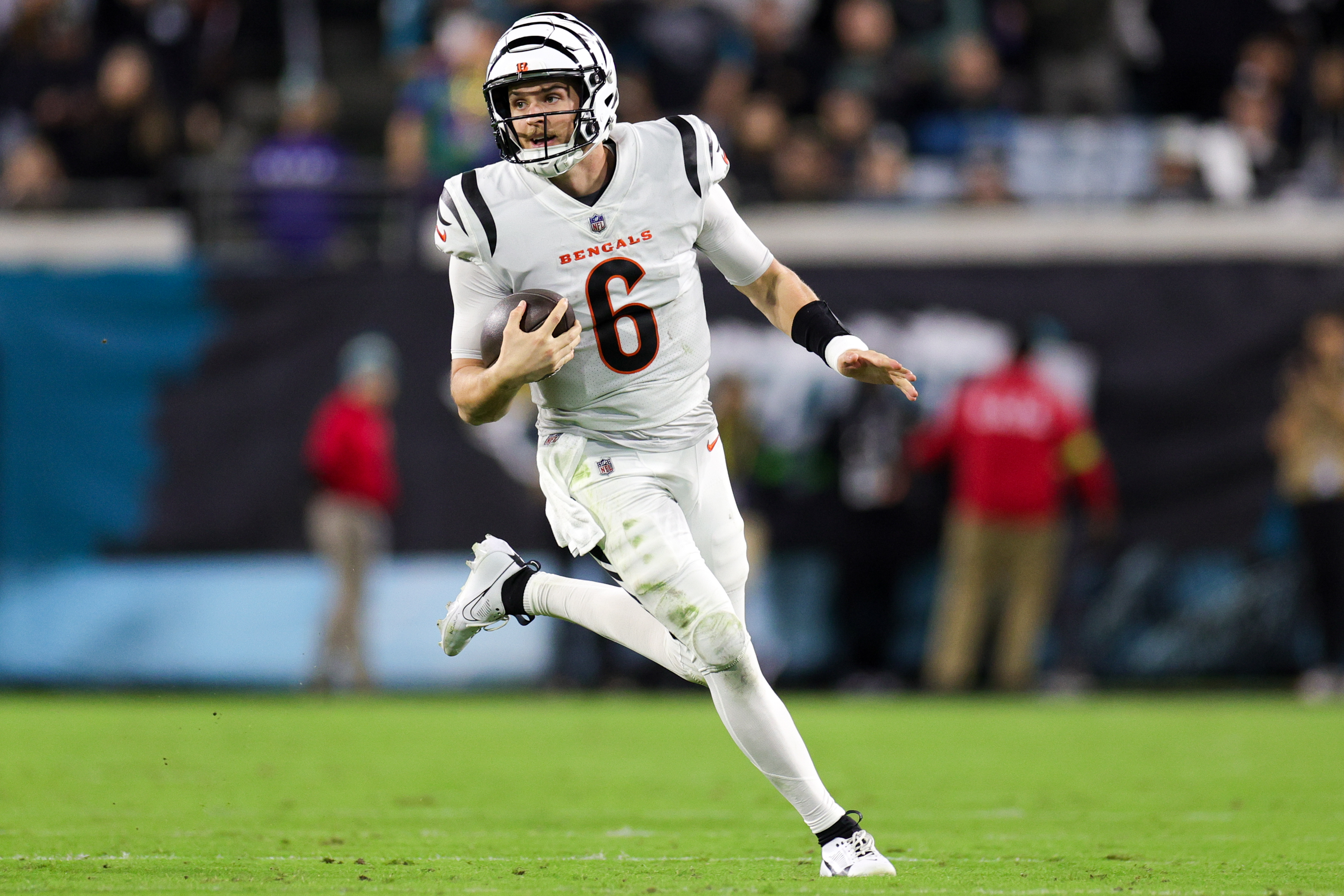 Jake Browning runs with the ball in one hand