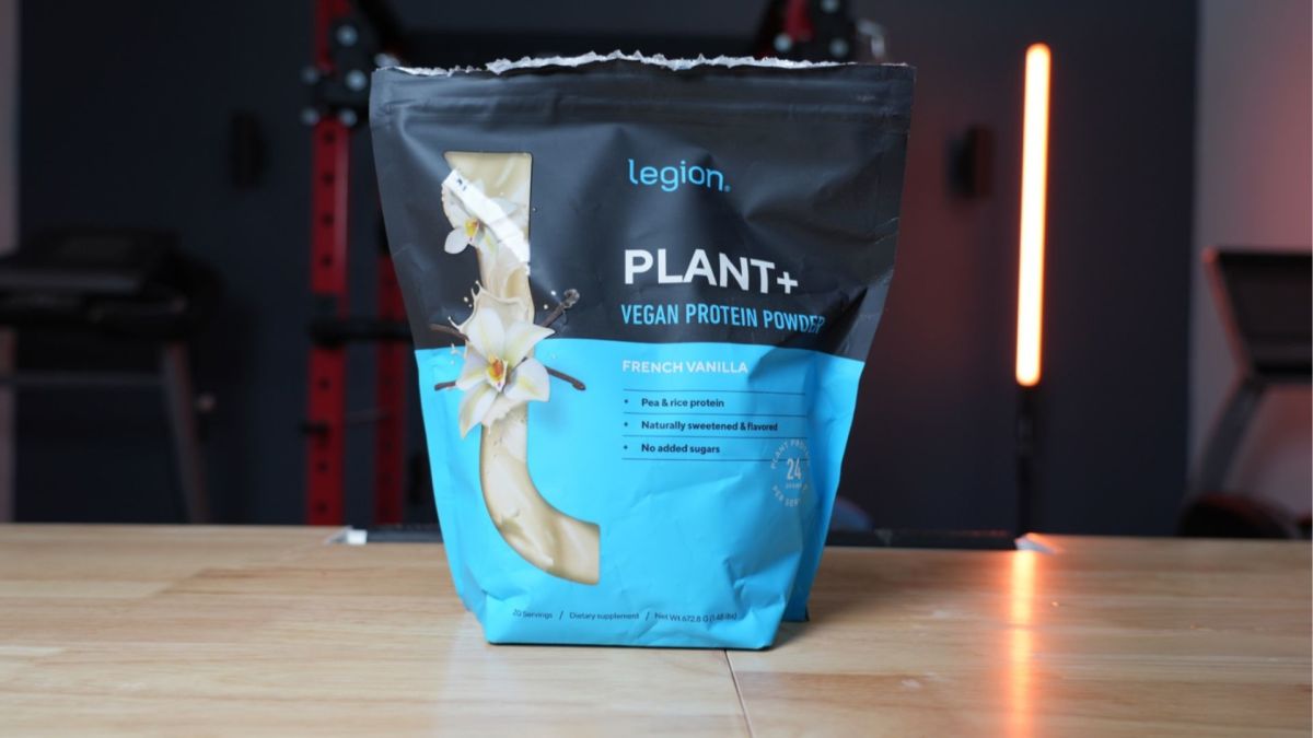 Picture of a black and blue bag labeled Legion Plant+ Vegan Protein Powder on a table