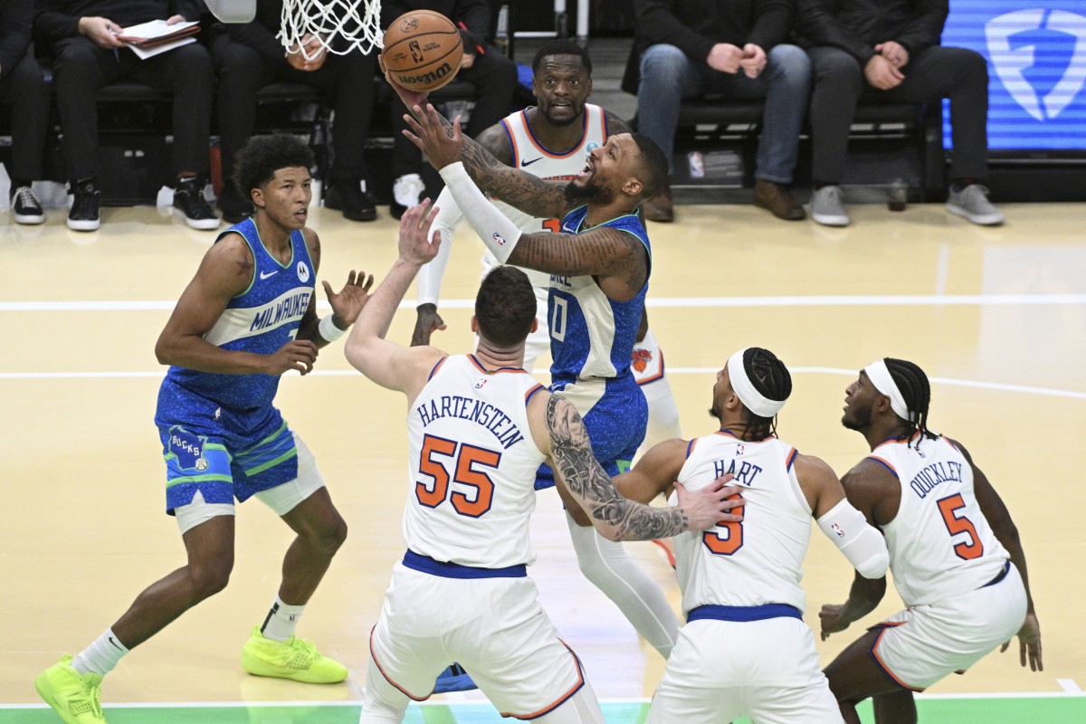Milwaukee Bucks guard Damian Lillard (0) drives to the basket against New York Knicks 
