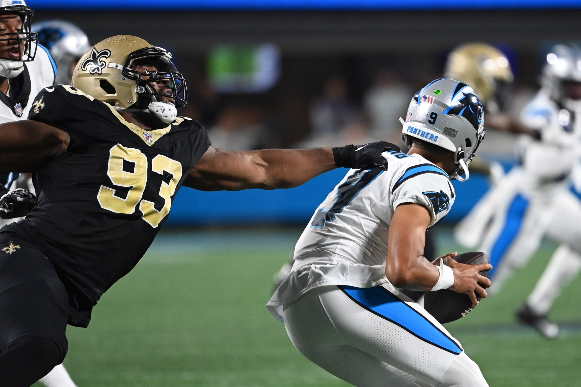 Carolina Panthers quarterback Bryce Young (9) is pressured by New Orleans Saints defensive tackle Nathan Shepherd (93). Mandatory Credit: Bob Donnan-USA TODAY Sports