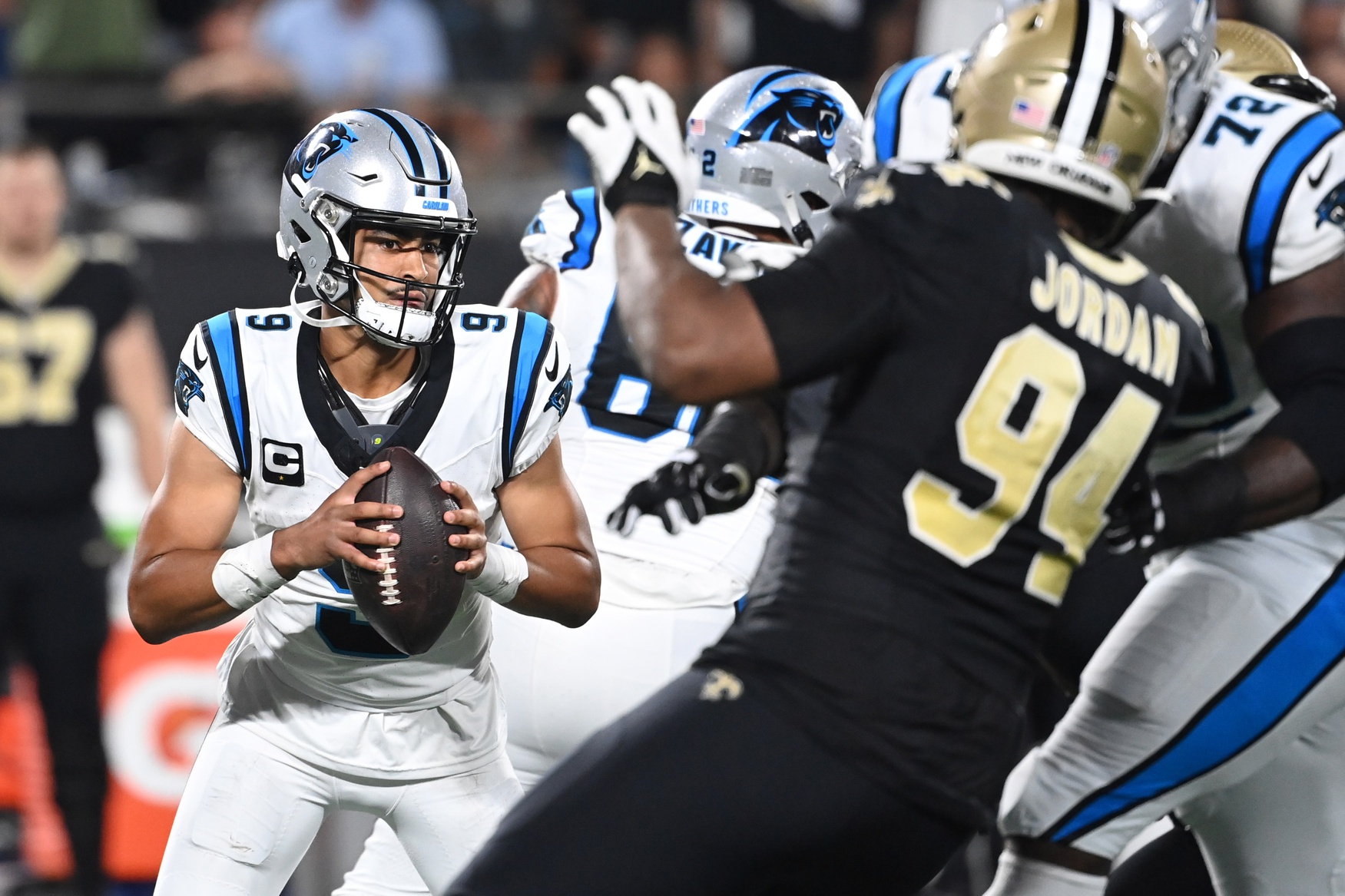 Carolina Panthers quarterback Bryce Young (9) looks to pass as New Orleans Saints defensive end Cameron Jordan (94) pressures. Mandatory Credit: Bob Donnan-USA TODAY Sports