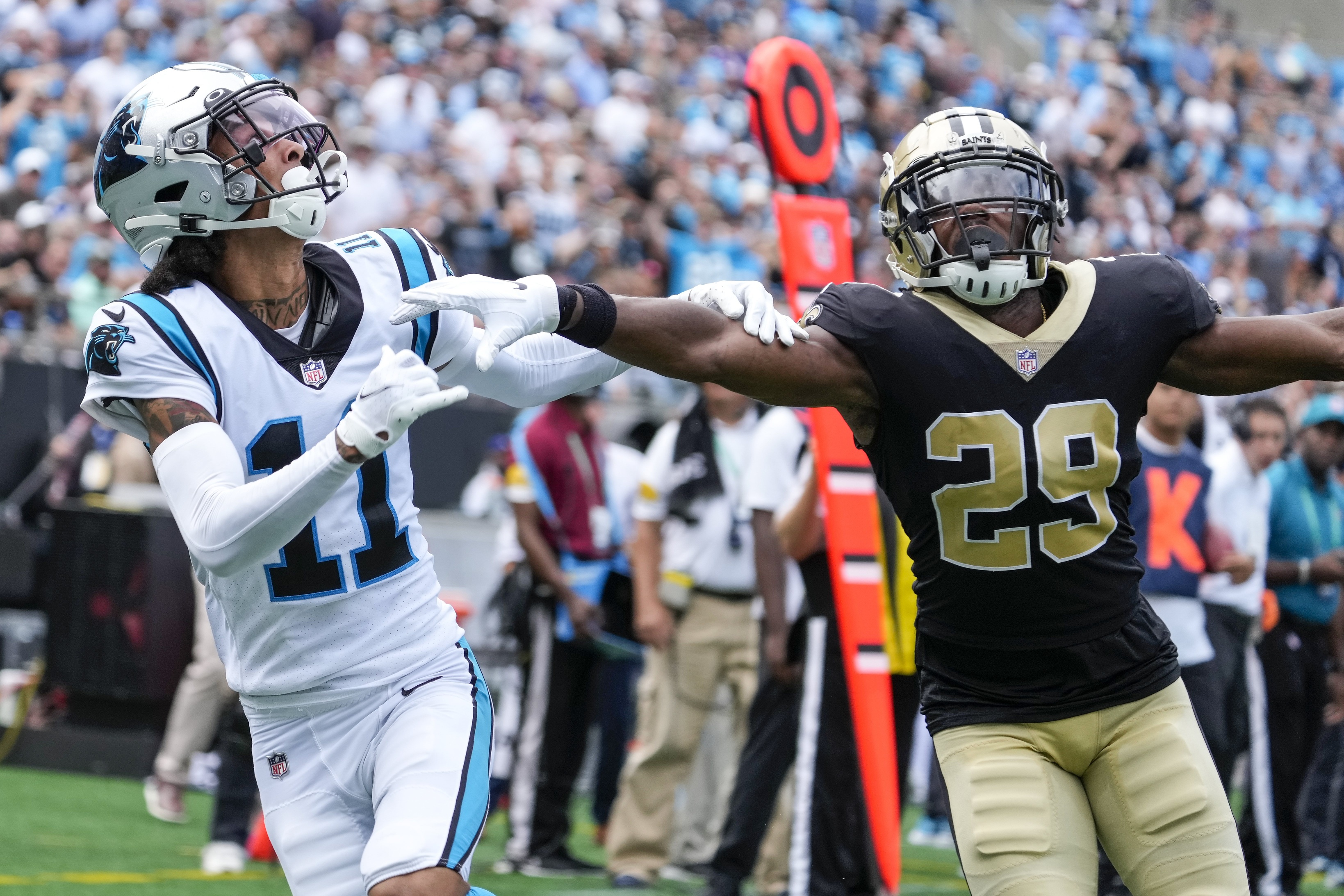 Sep 19, 2021; Carolina Panthers wide receiver Robby Anderson (11) and New Orleans Saints cornerback Paulson Adebo (29) vie for the reception. Mandatory Credit: Jim Dedmon-USA TODAY