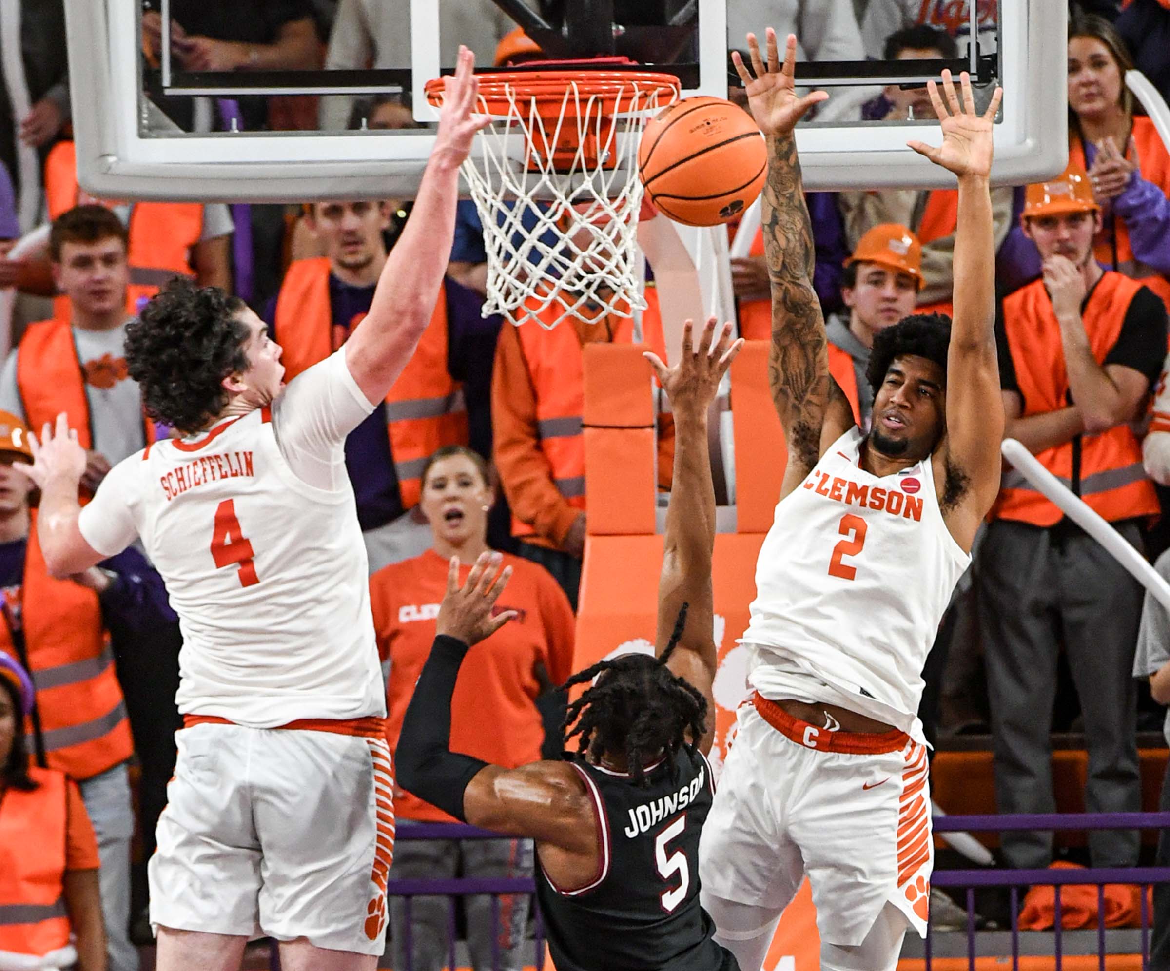 Meechie Johnson attempts to shoot floater over Clemson out reached defenders. 