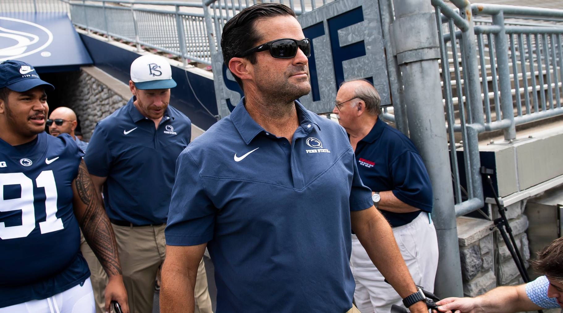 Penn State defensive coordinator Manny Diaz looks on while entering the field before a game.