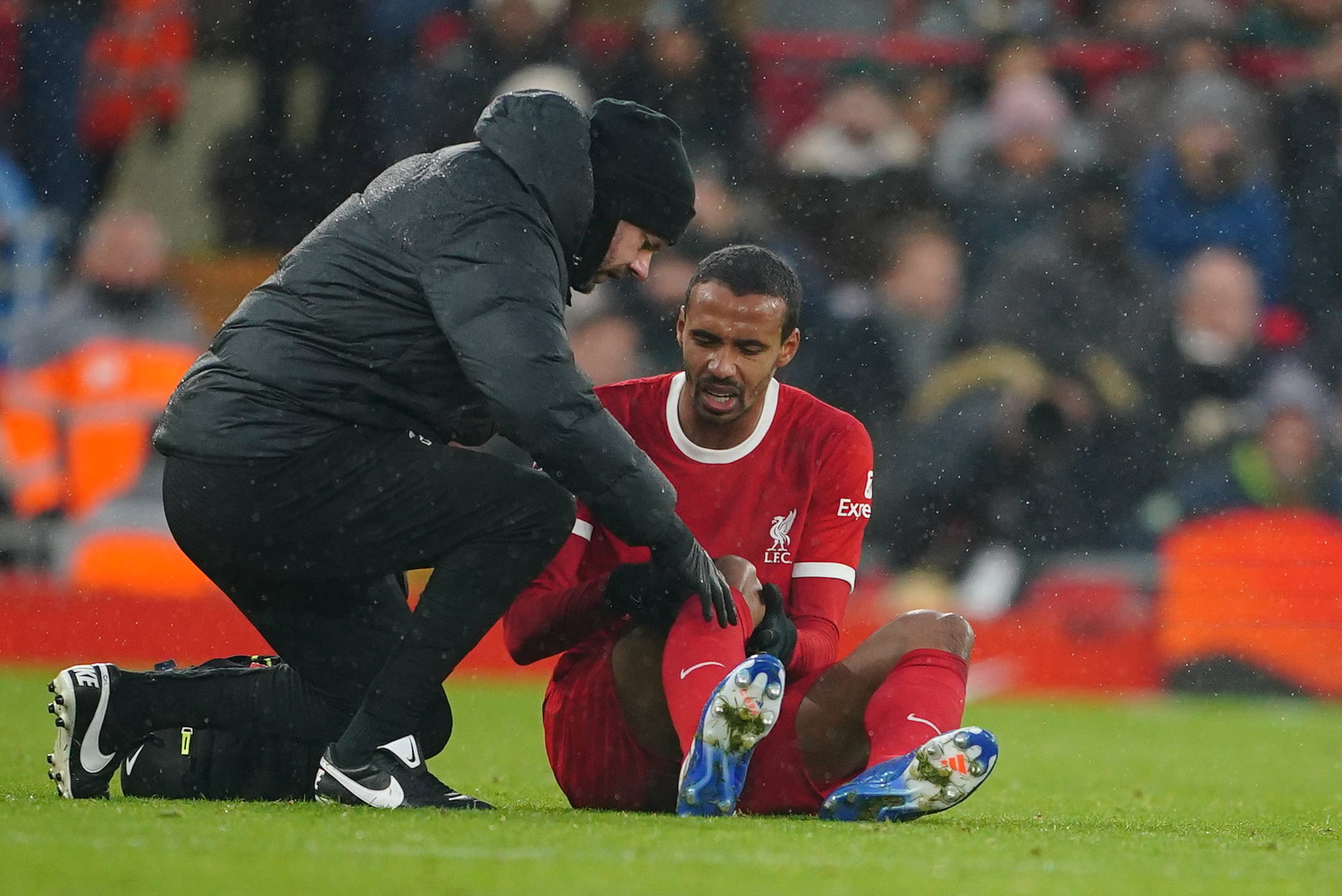 Joel Matip pictured receiving treatment for a knee injury during Liverpool's 4-3 win over Fulham in December 2023