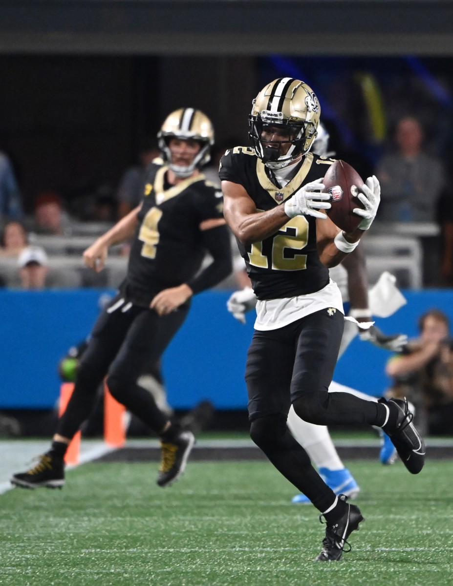 New Orleans Saints wide receiver Chris Olave (12) catches a pass against the Carolina Panthers. Mandatory Credit: Bob Donnan-USA TODAY Sports