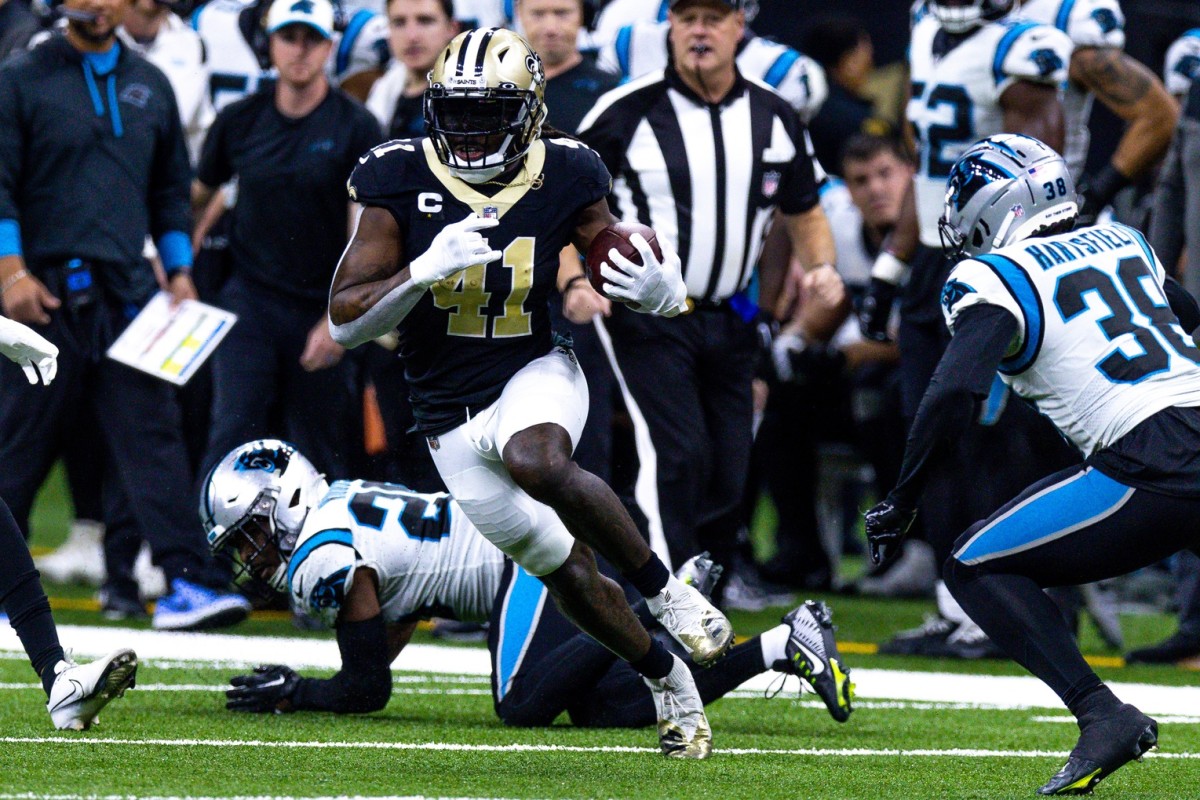 New Orleans Saints running back Alvin Kamara (41) in the open field against Carolina Panthers cornerback Myles Hartsfield (38) and safety Xavier Woods (25). Mandatory Credit: Stephen Lew-USA TODAY