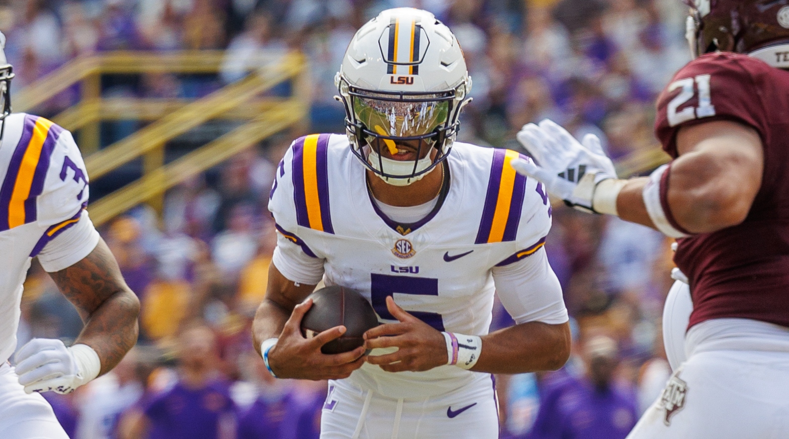 LSU quarterback Jayden Daniels rushes the ball during a game against Texas A&M.