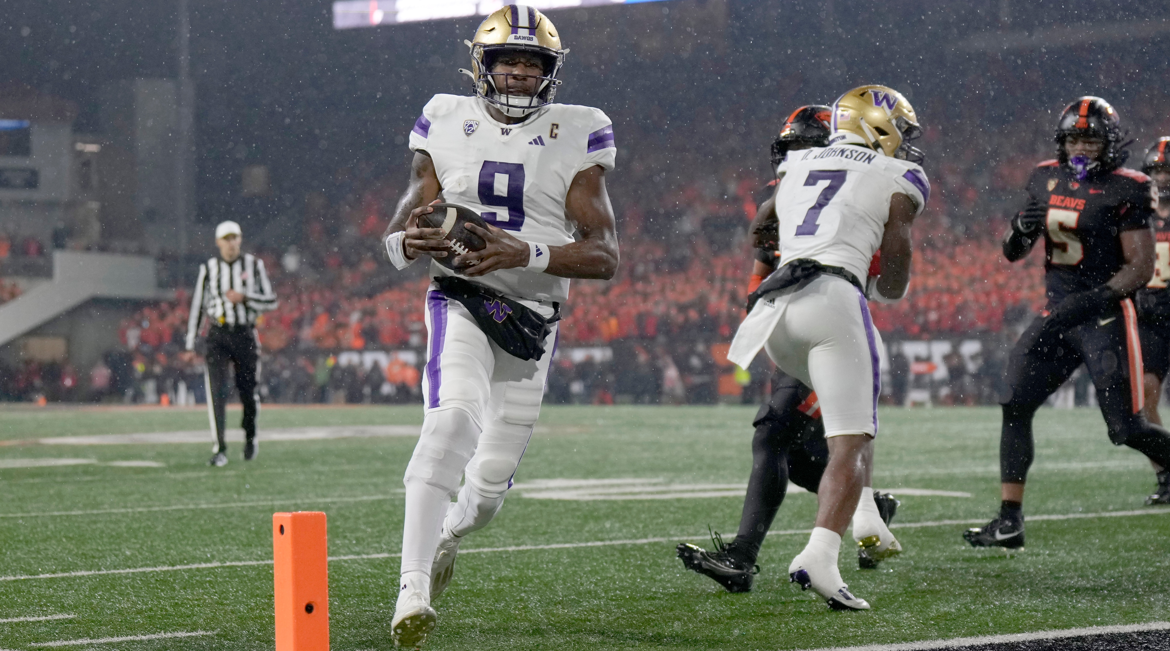 Washington quarterback Michael Penix Jr. runs into the end zone for a touchdown during a game against Oregon State.