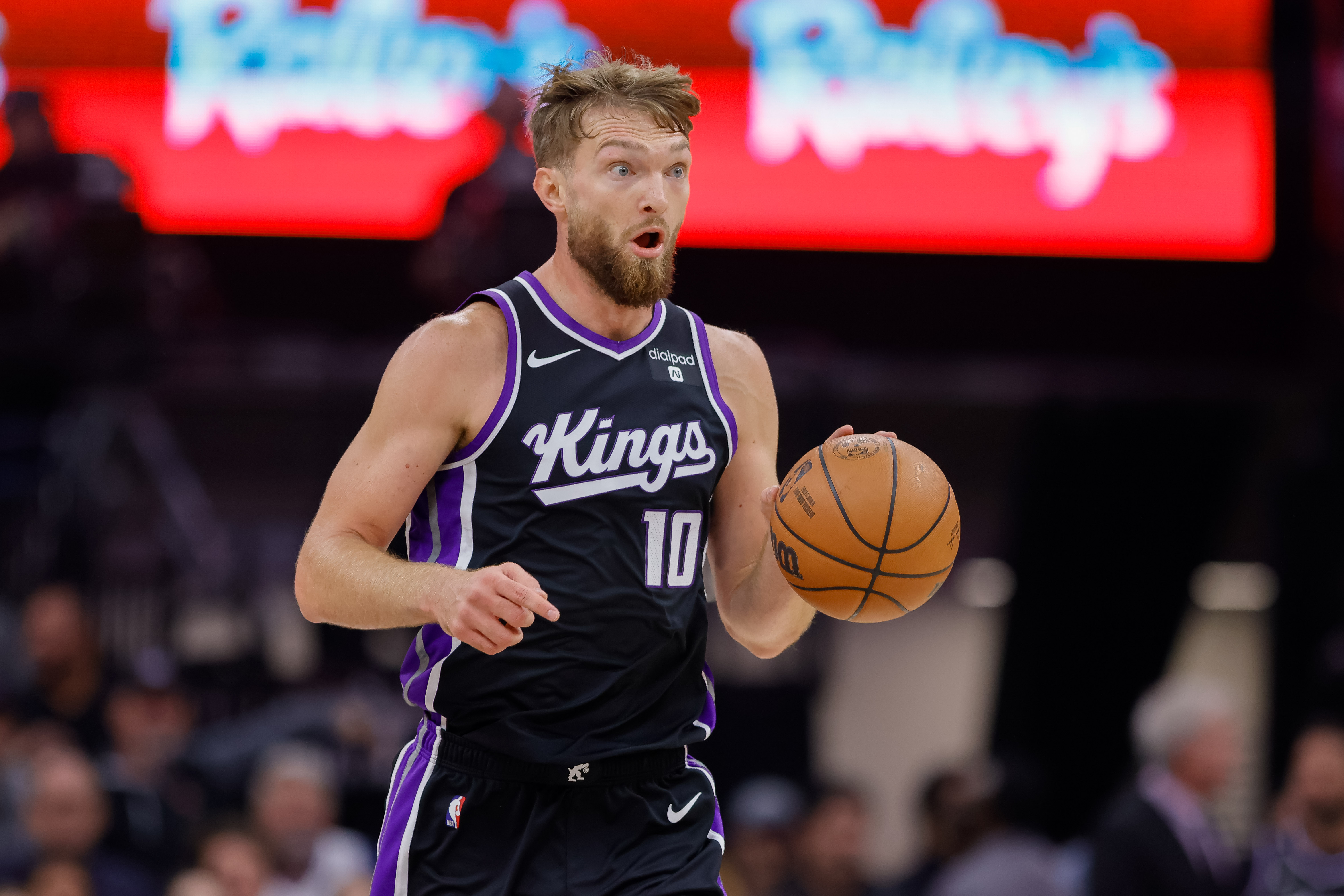Sacramento Kings forward Domantas Sabonis (10) dribbles the ball up the court against the Golden State Warriors during the first quarter at Golden 1 Center.