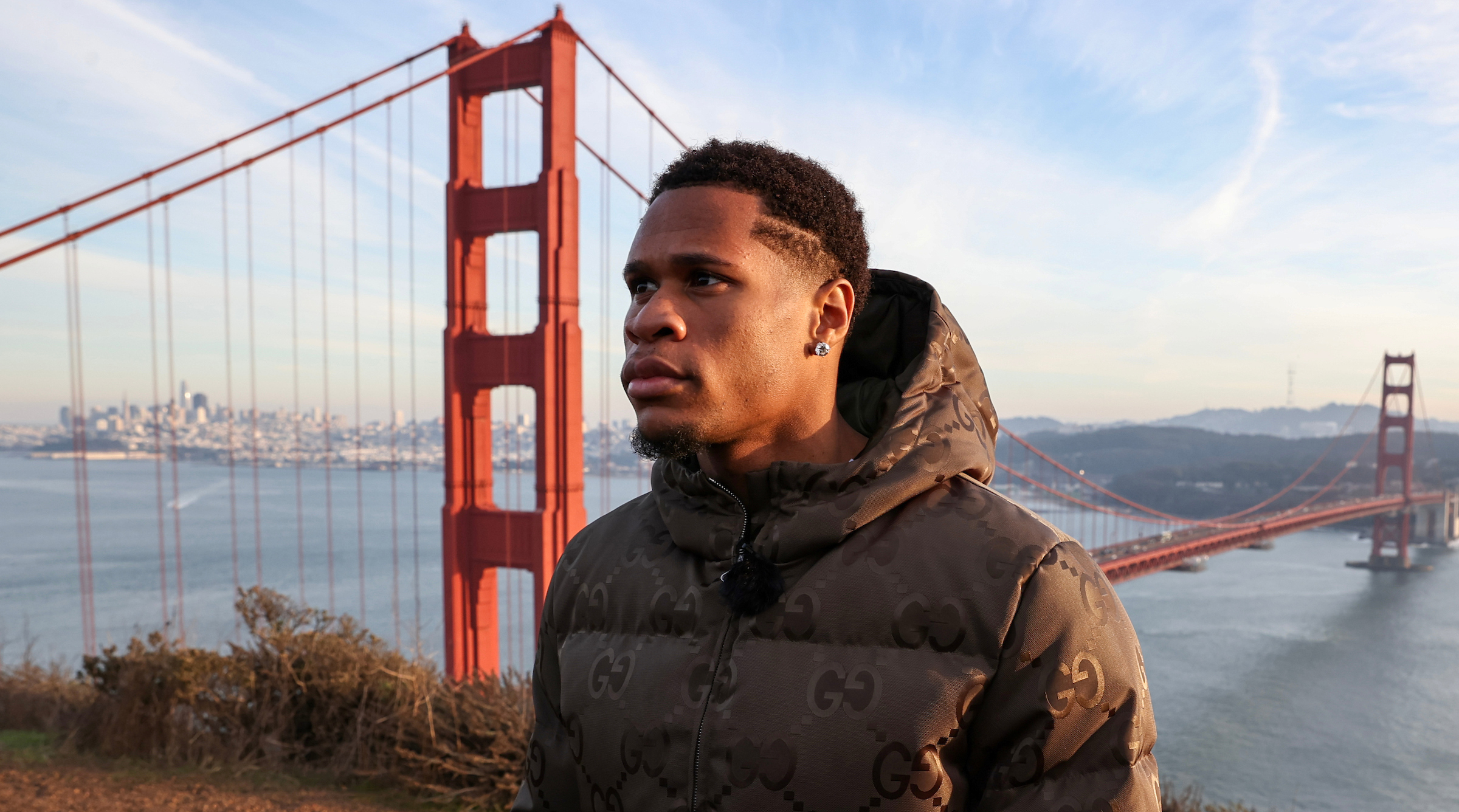 Devin Haney looks on after facing off with Regis Prograis at the Golden Gate Bridge Park ahead of their bout.