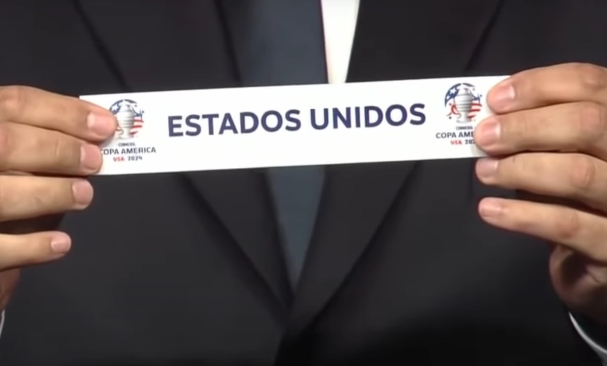 A close-up of a piece of paper featuring the name 'Estados Unidos' during the draw ceremony for the 2024 Copa America tournament