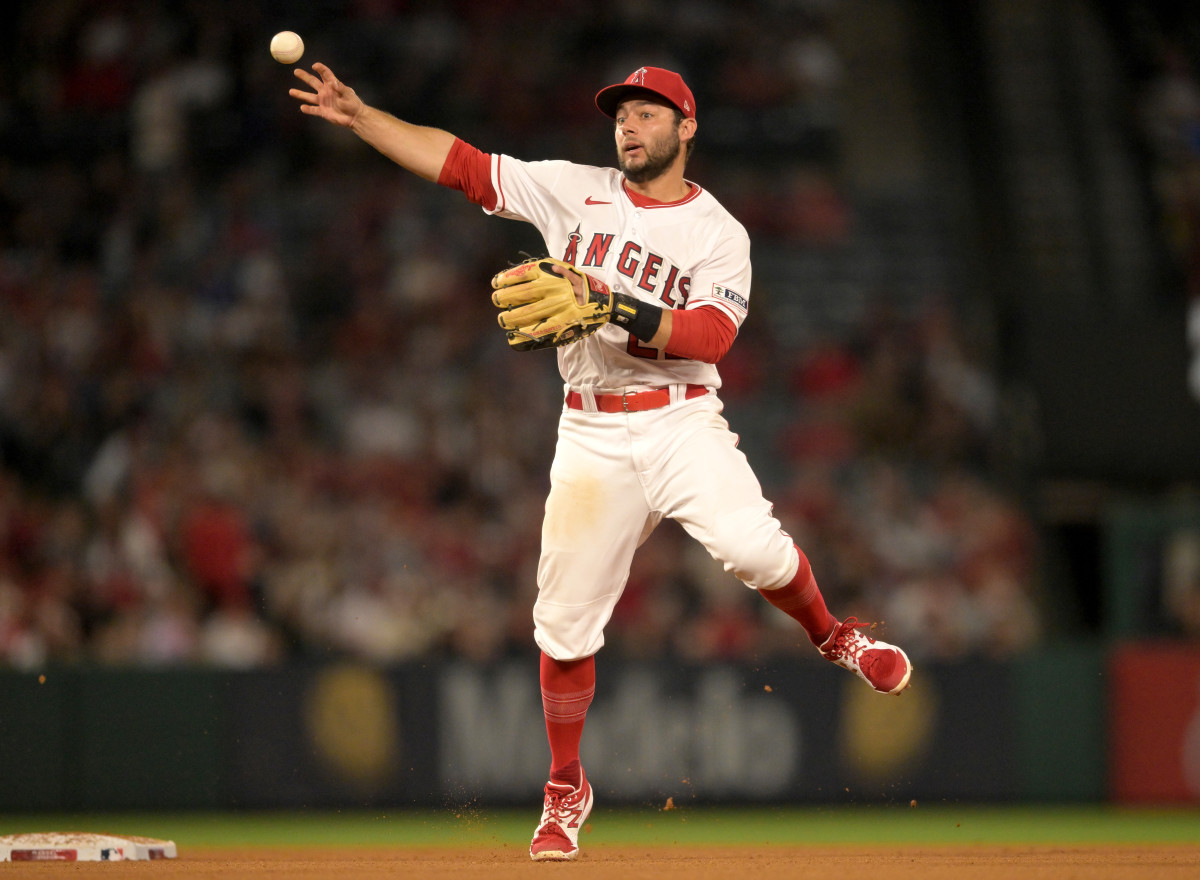 Jun 26, 2023; Anaheim, California, USA; Los Angeles Angels shortstop David Fletcher (22) throws Chicago White Sox center fielder Luis Robert Jr. (88) out at first in the eighth inning at Angel Stadium.