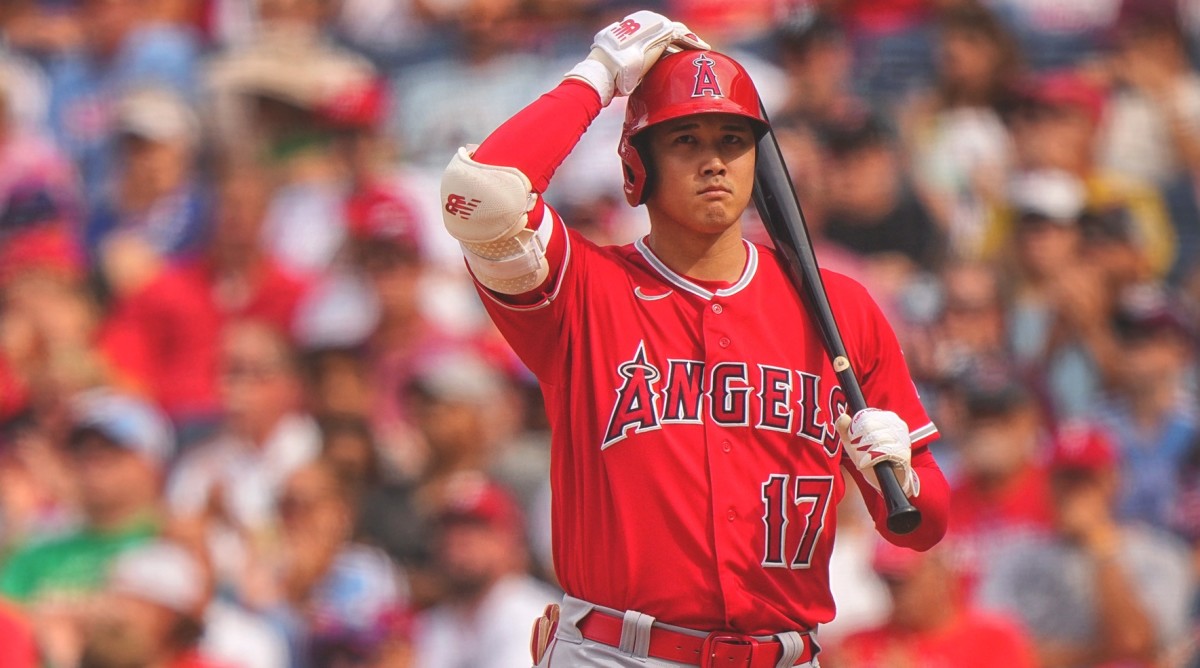 Angels star Shohei Ohtani stands with his bat during a game.
