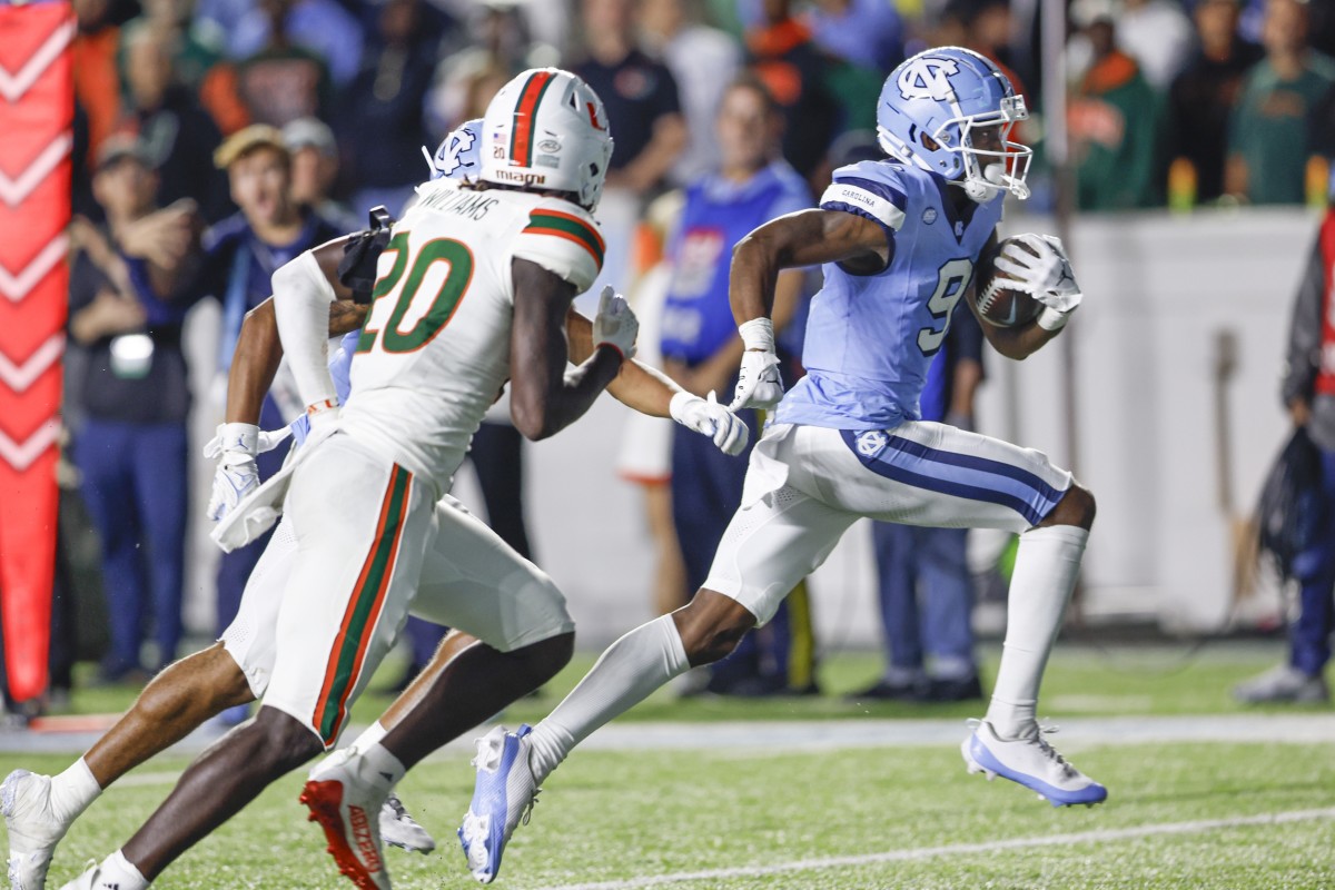 Oct 14, 2023; Chapel Hill, North Carolina, USA; North Carolina Tar Heels wide receiver Devontez Walker (9) runs for a touchdown after a catch against the Miami Hurricanes in the second half at Kenan Memorial Stadium.