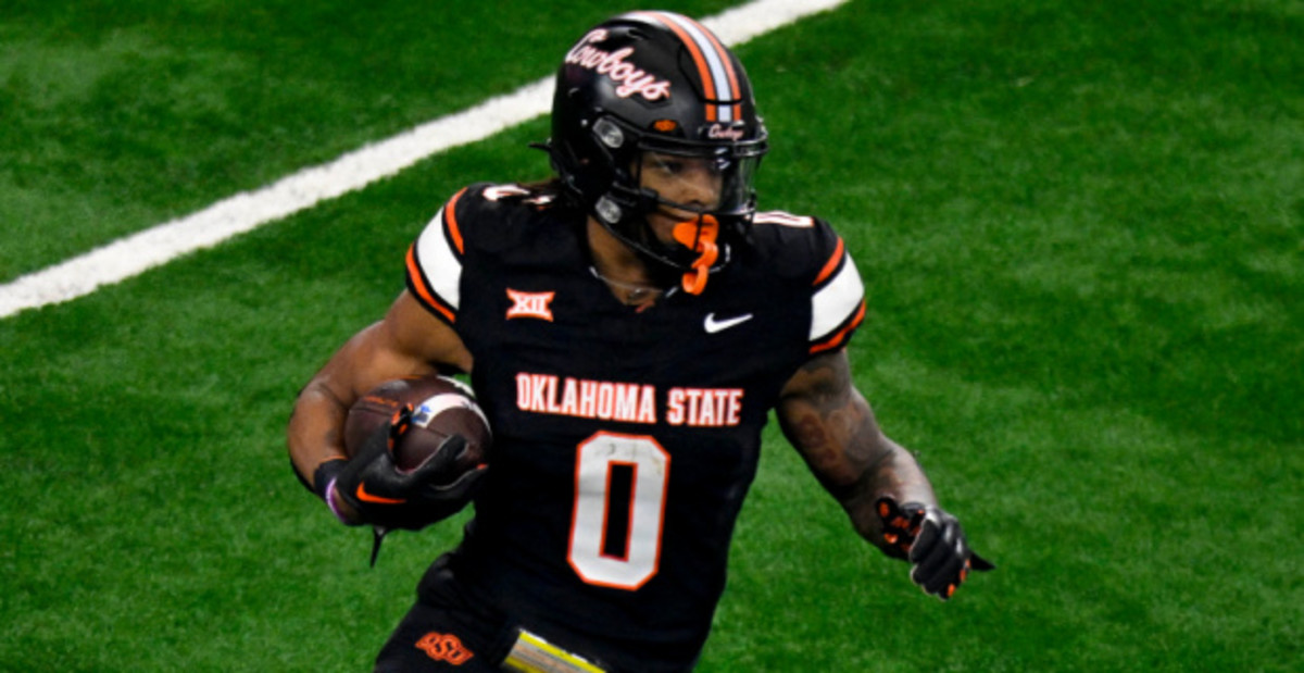 Oklahoma State Cowboys running back Ollie Gordon on a rushing attempt during a college football game in the Big 12.