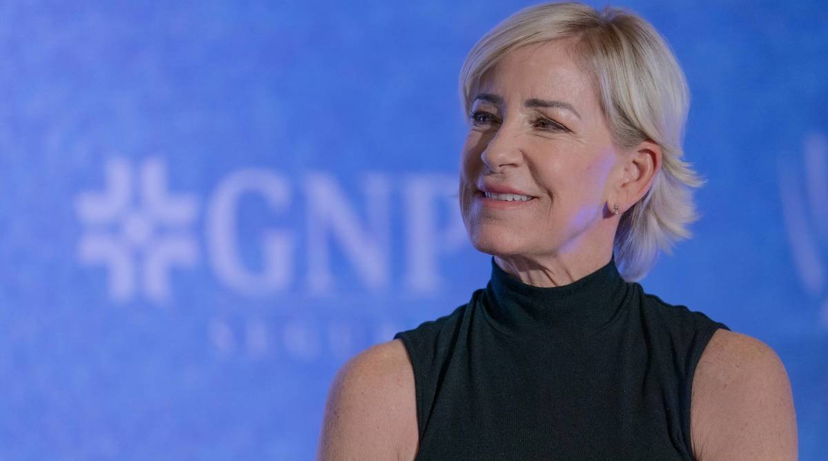 ESPN Tennis analyst Chris Evert looks on while meeting the media at a press conference.