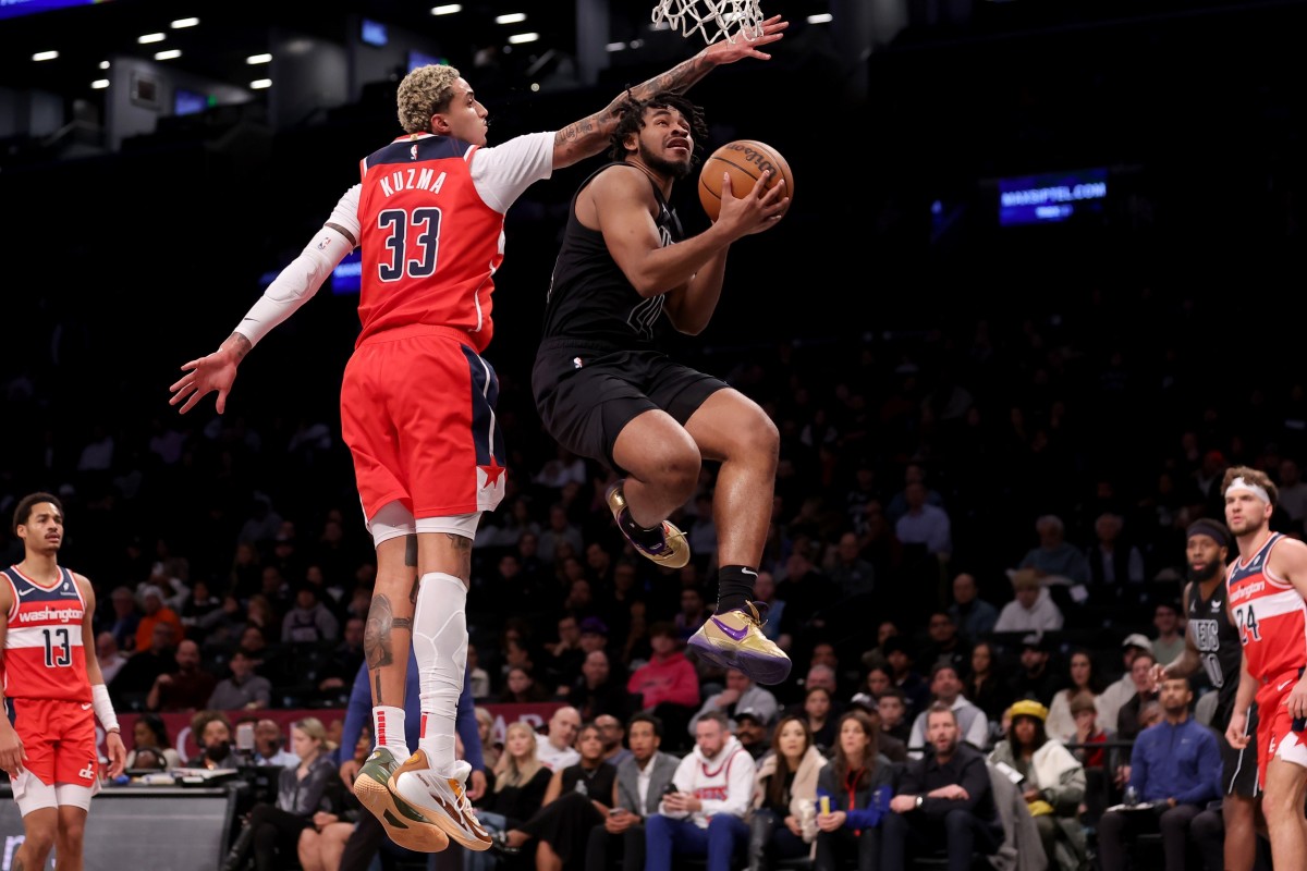 Brooklyn Nets guard Cam Thomas (24) drives to the basket against Washington Wizards forward Kyle Kuzma (33) during the first quarter at Barclays Center.