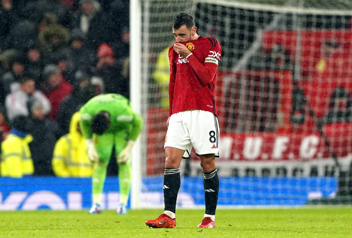 Manchester United captain Bruno Fernandes pictured looking dejected during his team's 3-0 loss to Bournemouth at Old Trafford in December 2023
