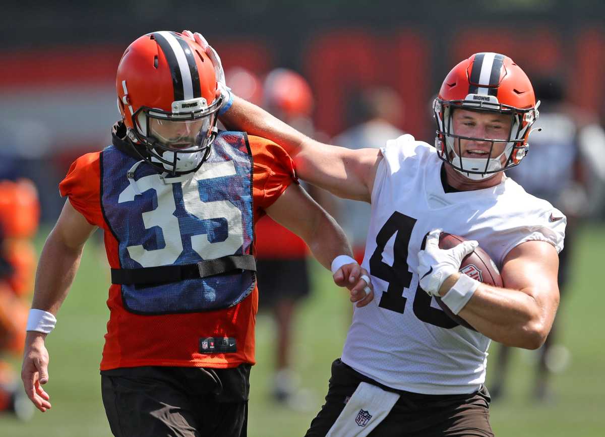 Cleveland Browns quarterback Baker Mayfield, left, knocks Cleveland Browns running back Johnny Stanton (40) out of bounds during NFL football practice, Thursday, Aug. 12, 2021, in Berea, Ohio. Brownscamp12 18
