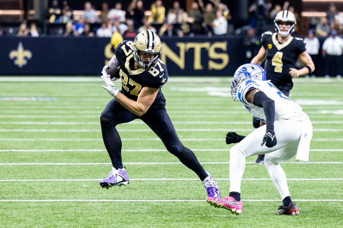 New Orleans Saints tight end Foster Moreau (87) runs after a catch against Detroit Lions safety Tracy Walker III (21). Mandatory Credit: Stephen Lew-USA TODAY