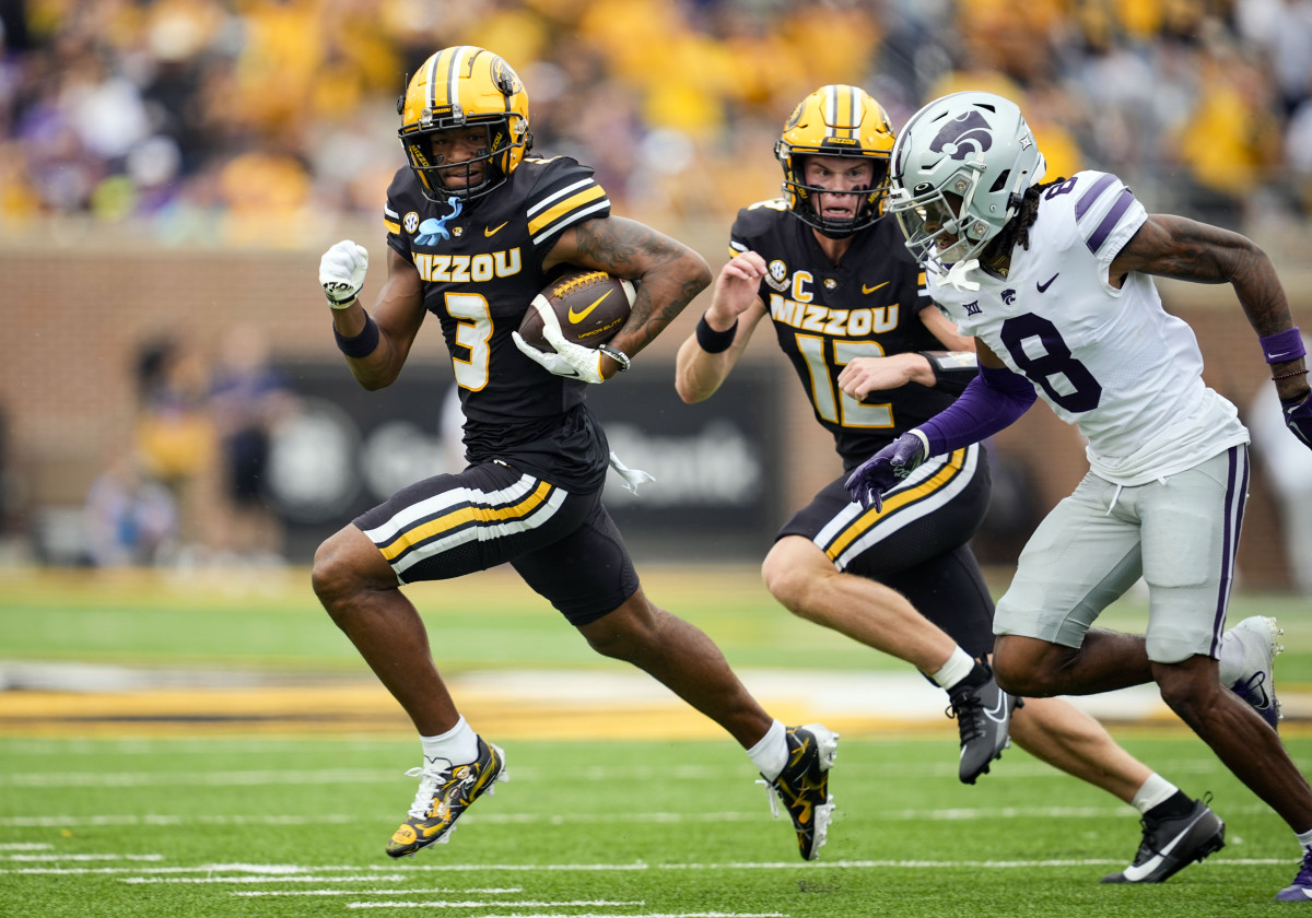 Sep 16, 2023; Columbia, Missouri, USA; Missouri Tigers wide receiver Luther Burden III (3) runs with the ball against Kansas State Wildcats cornerback Will Lee III (8) during the first half at Faurot Field at Memorial Stadium.