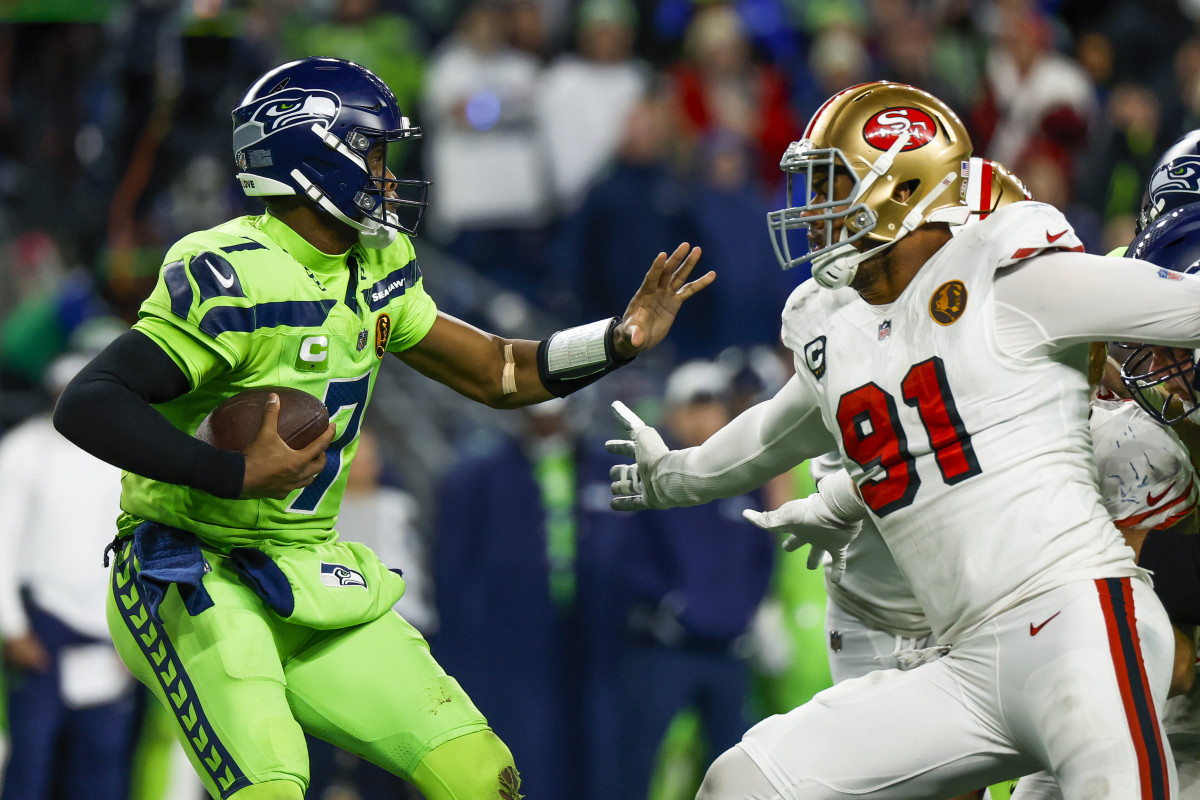 Nov 23, 2023; Seattle, Washington, USA; San Francisco 49ers defensive end Arik Armstead (91) sacks Seattle Seahawks quarterback Geno Smith (7) during the fourth quarter at Lumen Field.  