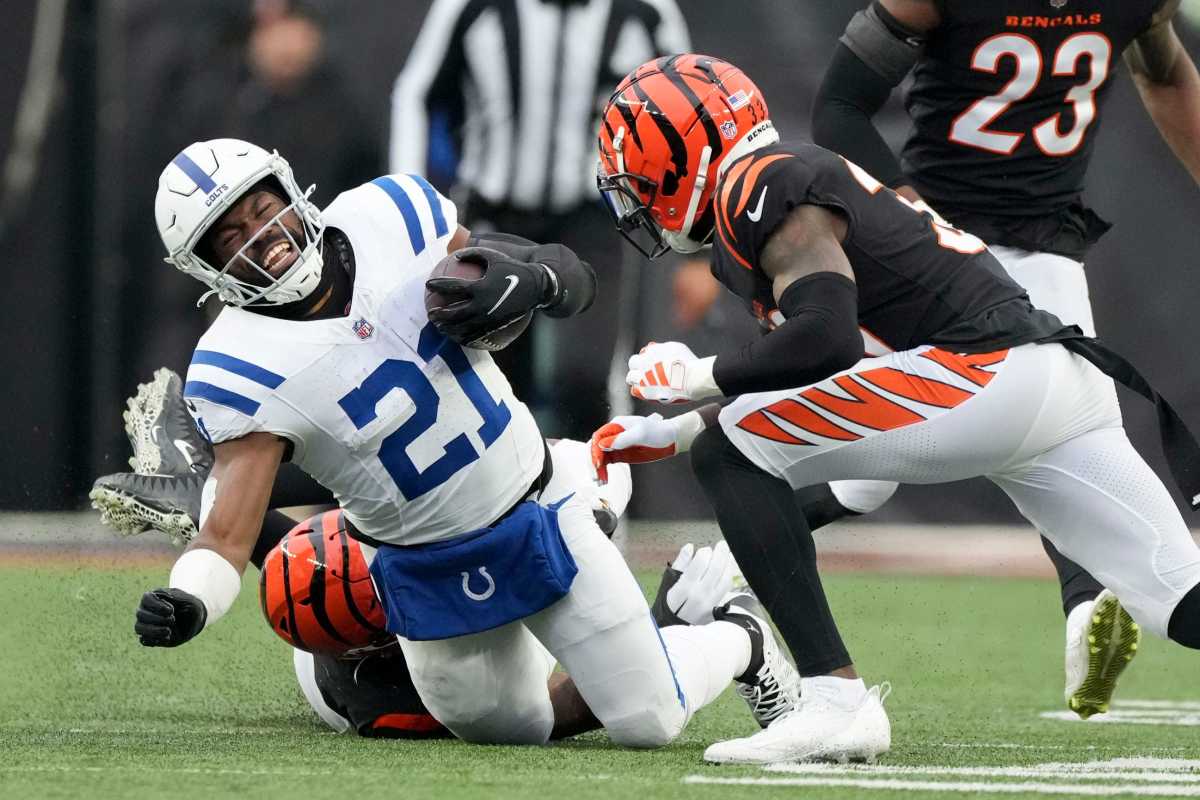 Cincinnati Bengals defensive tackle BJ Hill (92) brings down Indianapolis Colts running back Zack Moss (21) on Sunday, Dec. 10, 2023, during a game against the Cincinnati Bengals at Paycor Stadium in Cincinnati.
