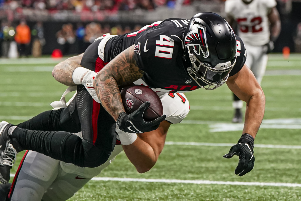 Tampa Bay Buccaneers defensive end Patrick O'Connor (79) tackles Atlanta Falcons fullback Keith Smith (40) for a safety during the first half at Mercedes-Benz Stadium.