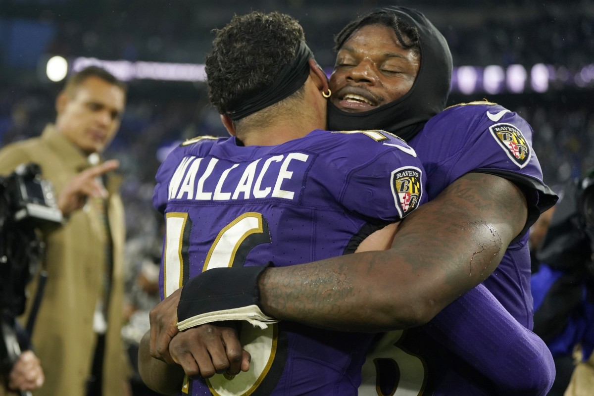 Ravens quarterback Lamar Jackson celebrates with Tylan Wallace after his 76-yard punt return for a touchdown in overtime to beat the Rams in Week 14.